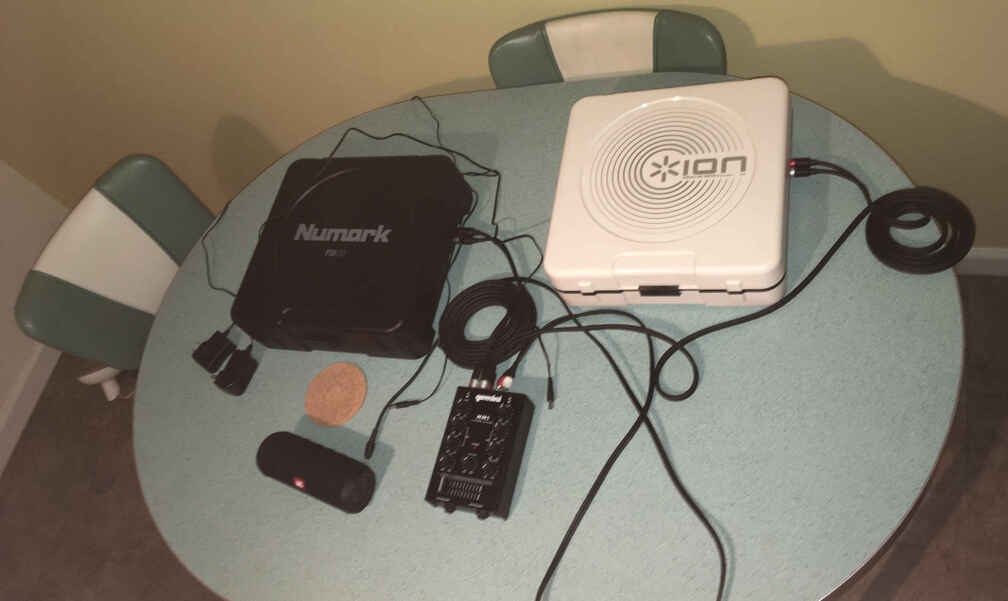 [Banner image representing the "Mixes"
page, showing two cheap turntables and a bundle of wires.]